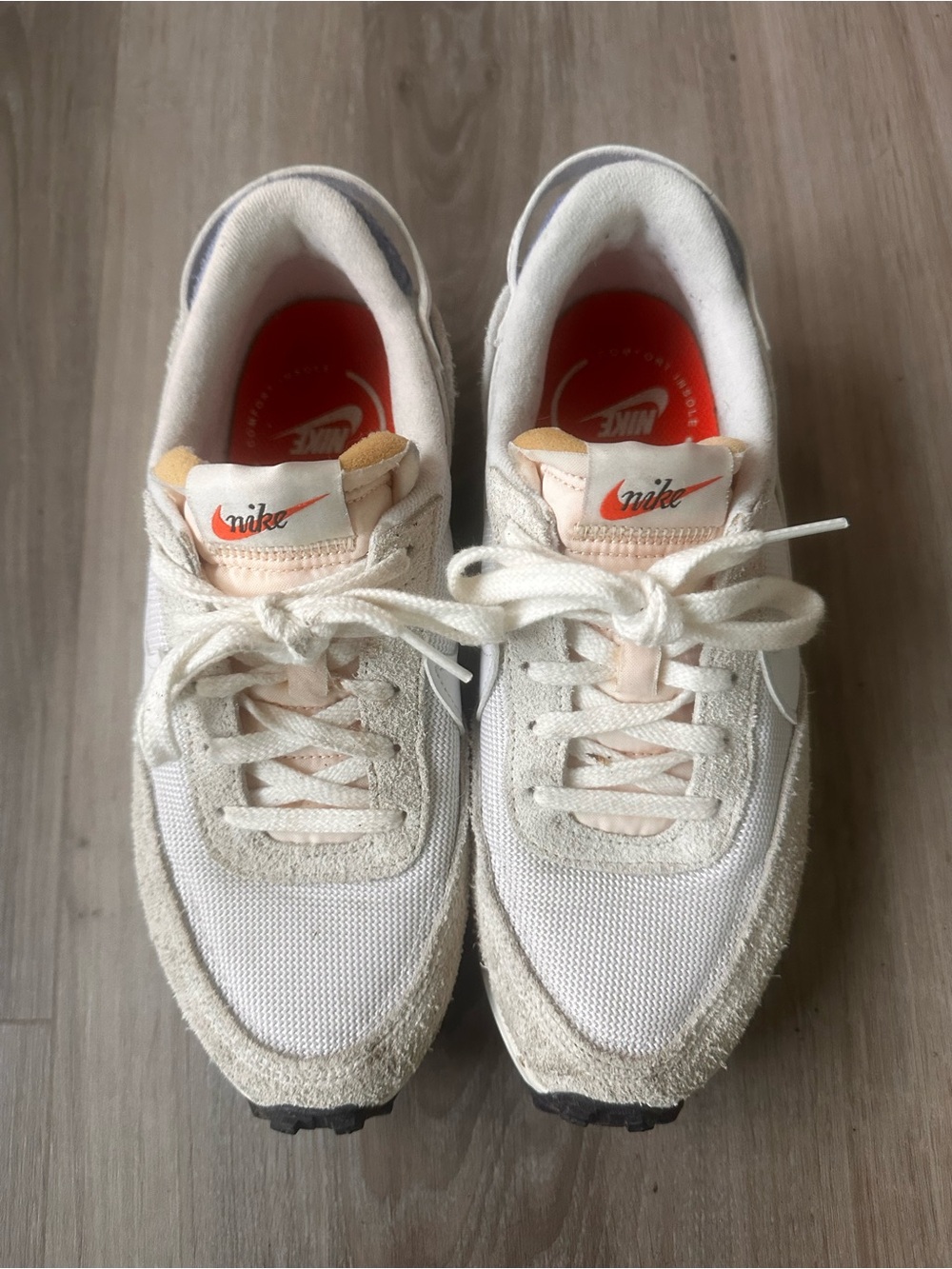 Nike Cream Running Shoes with White Swoosh and Blue Back.